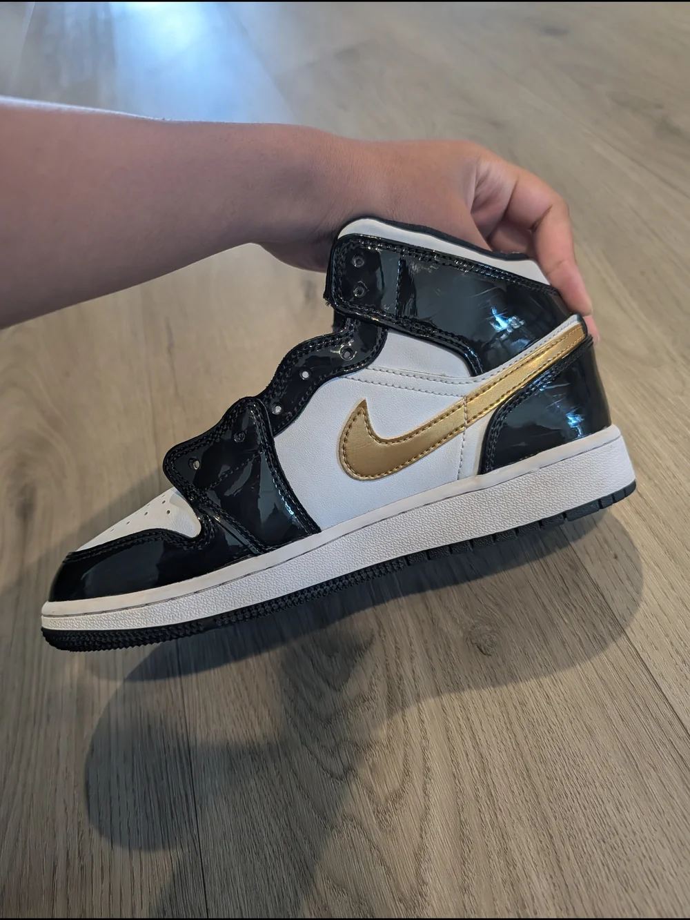 Jordan Kids High-Top Sneakers in White, Black, and Gold